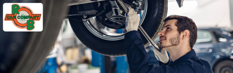 A mechanic providing professional auto service to a reliable sedan at R&B Car Company in South Bend.