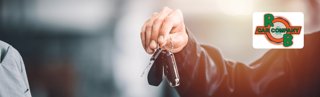 Max Allowance representative handing a check to a Mishawaka car seller at R&B Car Company, South Bend