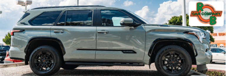 Row of used SUVs for sale at R&B Car Company South Bend lot on a sunny day.