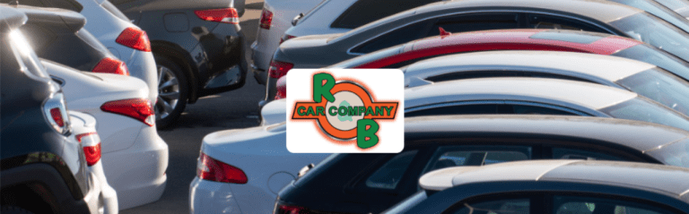 Customer reviewing used cars for sale in Indiana at R&B Car Company South Bend dealership lot.